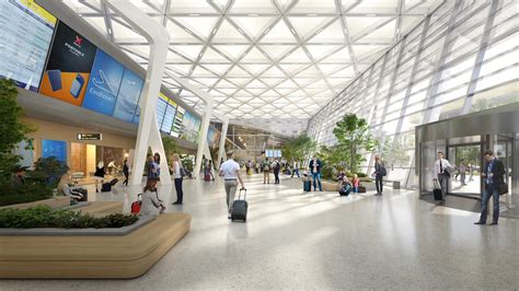 Overzicht van de terminal op Eindhoven Airport met zicht op check-in balies en veiligheidscontrole.