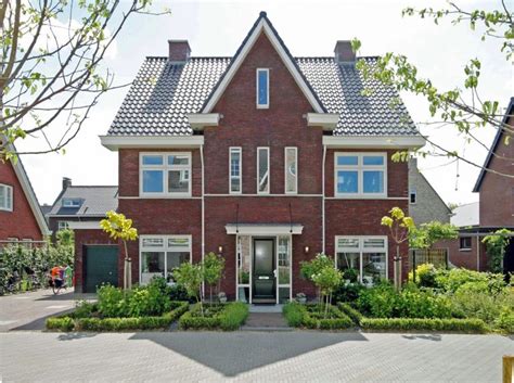 foto van de voorgevel van de vrijstaande woning aan de Hoogeveenseweg 14, Slagharen
