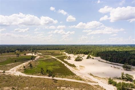 een panoramische foto van het natuurgebied Het Oerd met duinen en duinmeren