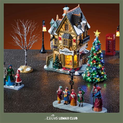 Een sfeervol verlicht kerstdorp met Lemax huisjes en figuren